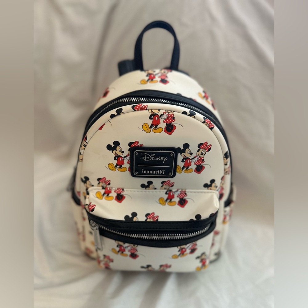 Loungefly backpack Minnie Mouse and Mickey Mouse from the Disney franchise.